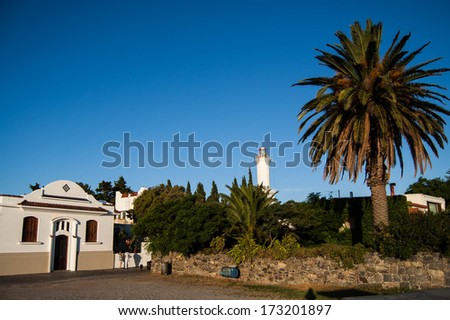 House, light house and palm tree