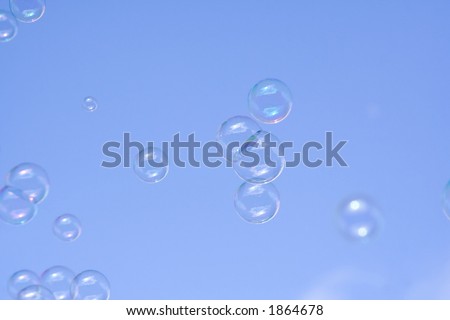 floating bubbles against a deep blue sky