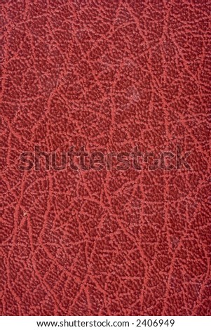 Deep red leather book cover texture and background image.