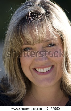 Head shot of a smiling soccer mom