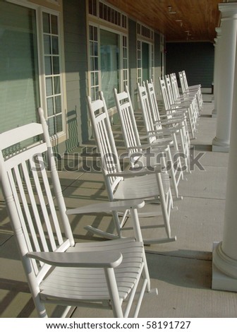 White Rocking Chairs Line the Veranda