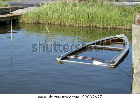 Sinking boat at the shoreline