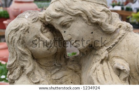 Garden statue of two young lovers