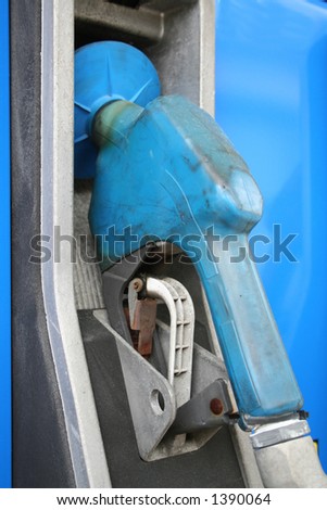 Blue gas pump hanging in it\'s cradle