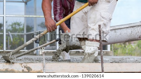 Cement Pour Worker\'s pouring a cement patio