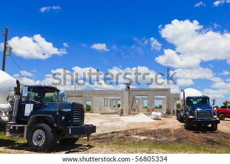 New Block home Construction with cement trucks on site