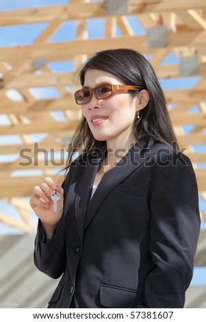 Asian Woman Contractor with keys in her hand