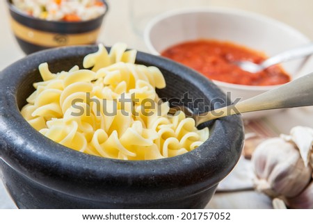 italian pasta boiled and served with tomato sauce and garlic