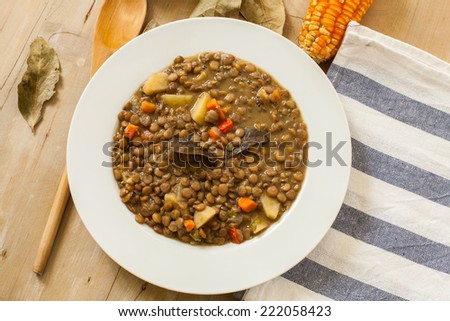 lentil with vegetables served on white plate