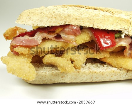 Breaded chicken breast whit bacon and pepper supersandwich of wholemeal bread