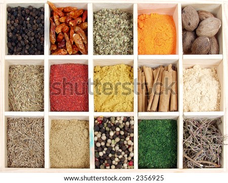 Assortment of spices for prepare tasty food on wooden box.