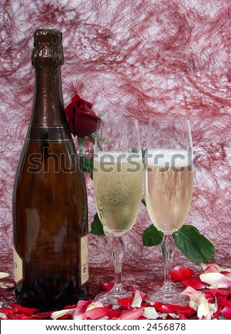 champagne bottle and two cups for celebrate san valentine`s day