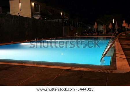 Luxury hotel swimming pool at the night