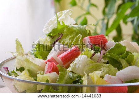 crabstick salad with assorted salad leaf and onions