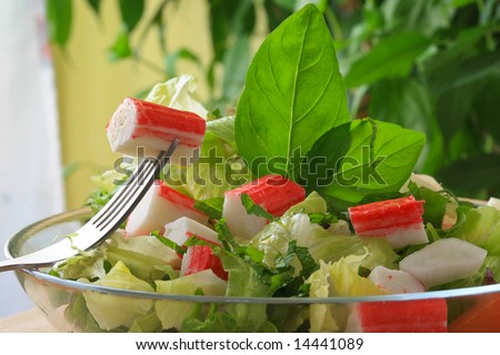 crabstick salad with assorted salad leaf and onions