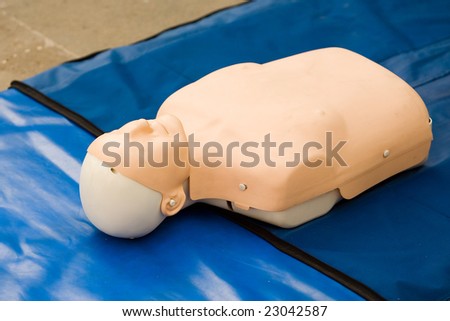 first aid training dummy on blue background