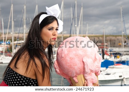 a pin up fashion girl on a yacht with big ice cream