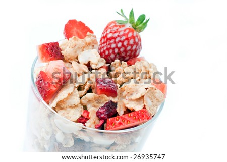 bowl with corn flakes and strawberry served on glass