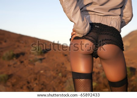 stock photo black sexy woman ass on blue sky background
