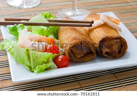 Crispy chinese egg roll with lettuce and tomato