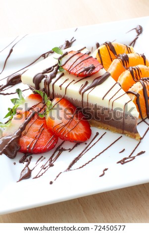 three types of chocolate cake with strawberries