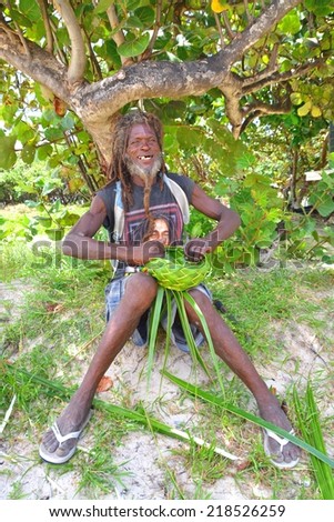 CASTRIES, ST. LUCIA, SEPTEMBER 16: An unidentified man in St. Lucia making handcraft on SEPTEMBER 16, 2014 in Santa Lucia