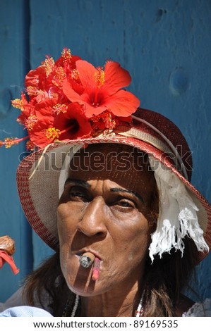 Cuban lady with big cigar in the streets of Havana, Cuba