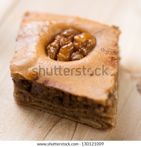 Baklava: asian cuisine made of layers of pastry, filled with chopped nuts and sweetened with honey