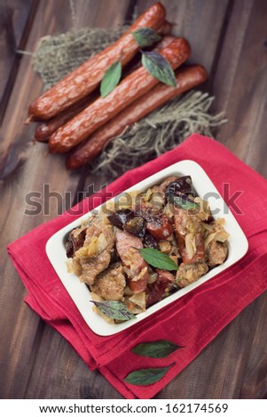 Hunter stew bigos made of cabbage and various meats, above view