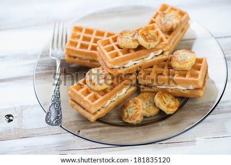 Waffles with fried banana on a glass plate, horizontal shot