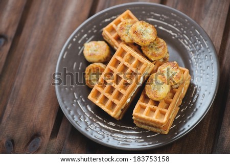 Waffles with grilled banana, dark wooden background