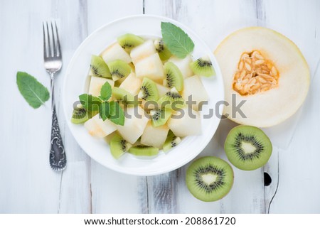 Melon and kiwi fruit salad, view from above, horizontal shot