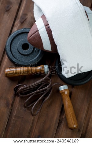 American football and various sports equipment, above view