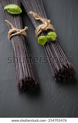 Raw black rice noodles, selective focus, shallow depth of field