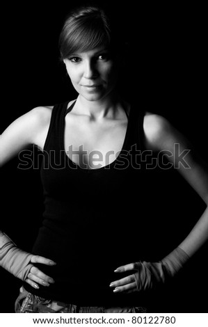 Sportive young woman in boxing-bandage, black and white photo
