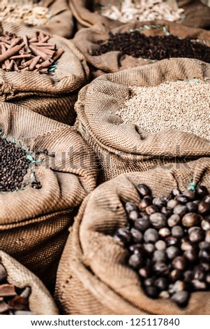 Spices and herbs in bags at market in India ( HDR image )