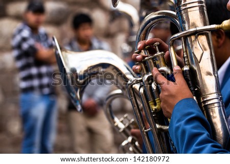 Trombones playing in a big band.