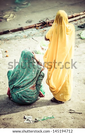 Women with colorful saris in Varanasi, India.