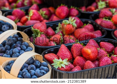 Baskets Of Fresh Strawberries In A Street Market