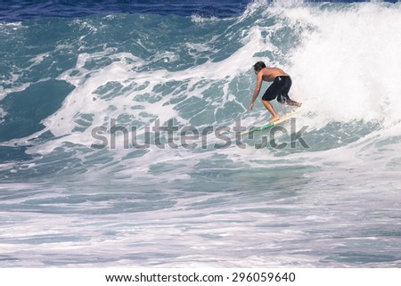 MAUI, HI - MARCH 09: Professional surfer rides a giant wave at the legendary big wave surf break 