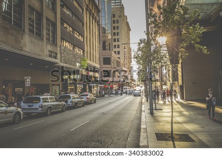 SYDNEY - OCTOBER 27: Tourists along city streets, October 27, 2015 in Sydney. The city receives 7.5 million domestic overnight visitors every year.