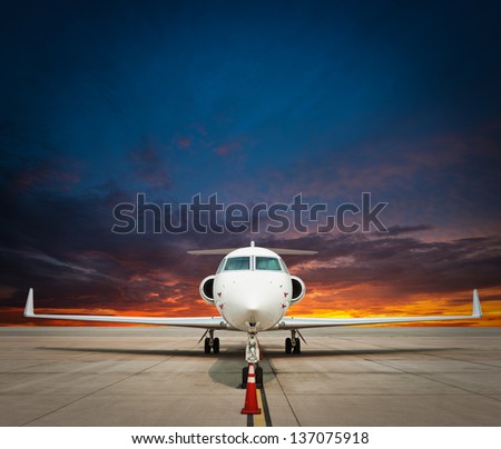 jet plane parked with nice sky