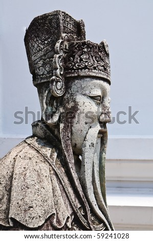 Old man statue in chinese style. Wat Pra Pathom Chedi, Thailand.
