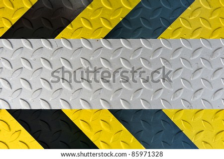 Yellow and black warning sign on Metal Plate