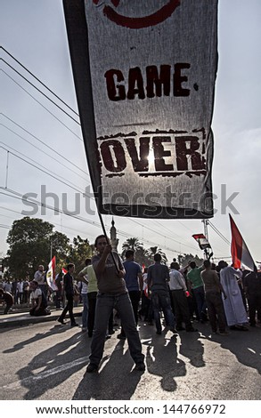CAIRO, EGYPT - JULY 1:Egyptian protesting carrying big flag with \