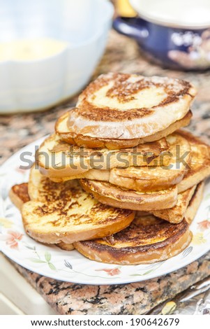 Stack of cinnamon french toast with butter