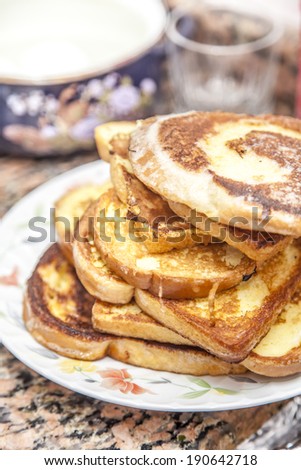 Stack of cinnamon french toast with butter