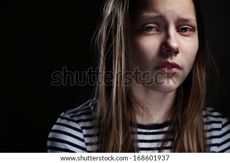 Dark Portrait Of A Crying Teen Girl, Studio Shot
