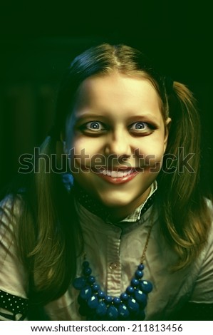 Clown teen girl with a sinister smile