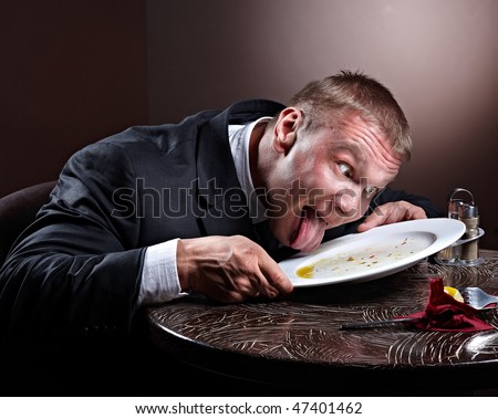 http://image.shutterstock.com/display_pic_with_logo/61979/61979,1267049565,4/stock-photo-muscular-businessman-lick-the-plate-47401462.jpg